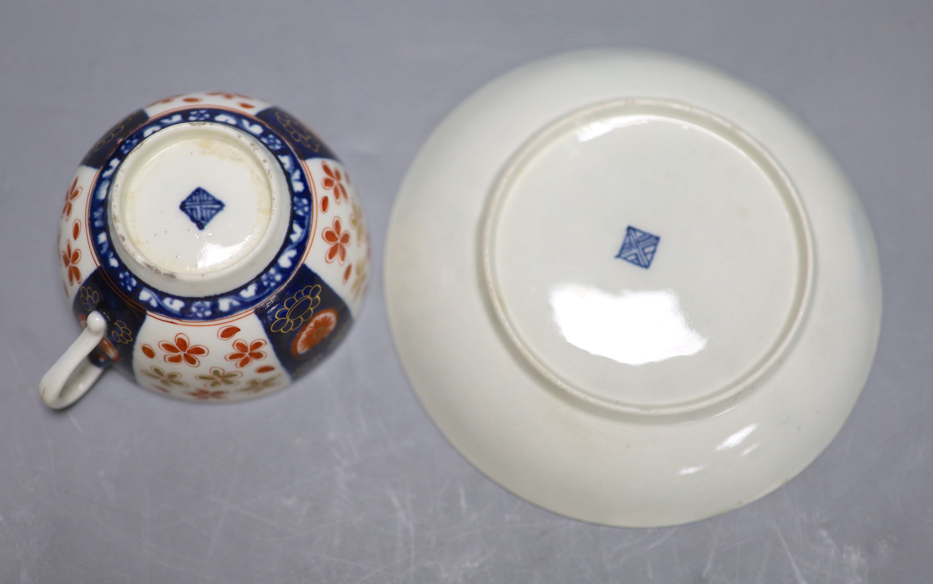 An 18th century Worcester cup and saucer painted with the Old Japan Star pattern, diameter 13cm